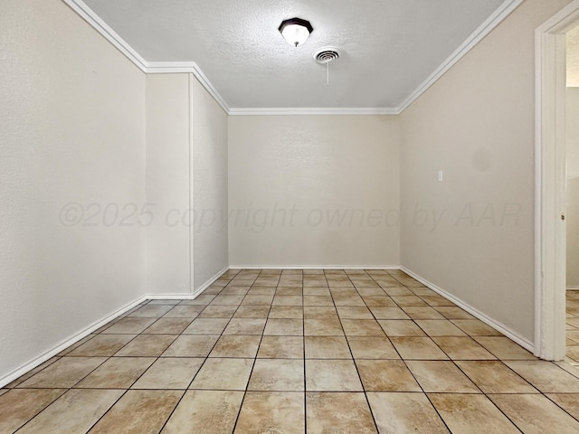 empty room with a textured ceiling, baseboards, visible vents, and ornamental molding