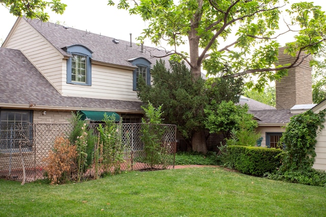 4321 Emil Ave, Amarillo, TX 79106 - rear view of house featuring a shingled roof and a chimney