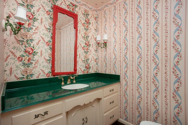 4321 Emil Ave, Amarillo, TX 79106 - bathroom featuring wallpapered walls and vanity