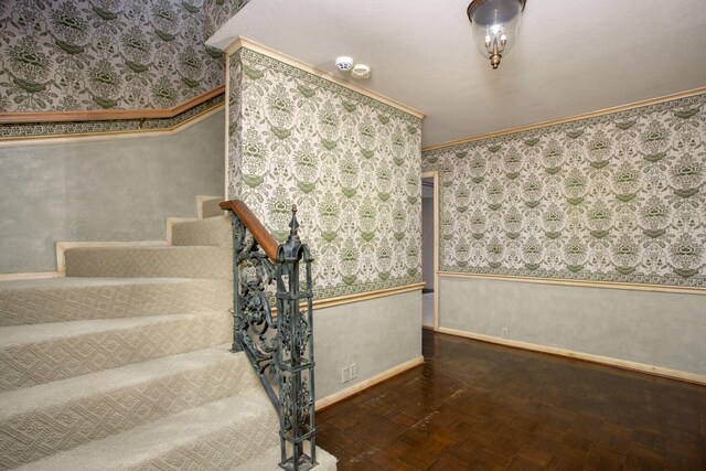 4321 Emil Ave, Amarillo, TX 79106 - staircase featuring baseboards, wallpapered walls, and ornamental molding