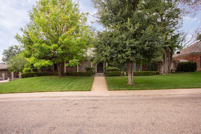 4321 Emil Ave, Amarillo, TX 79106 - obstructed view of property with a front lawn