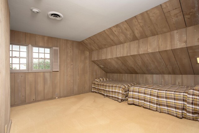 4321 Emil Ave, Amarillo, TX 79106 - additional living space featuring wood walls, carpet flooring, and lofted ceiling