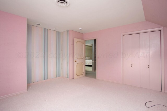 4321 Emil Ave, Amarillo, TX 79106 - unfurnished bedroom with carpet, a closet, and baseboards