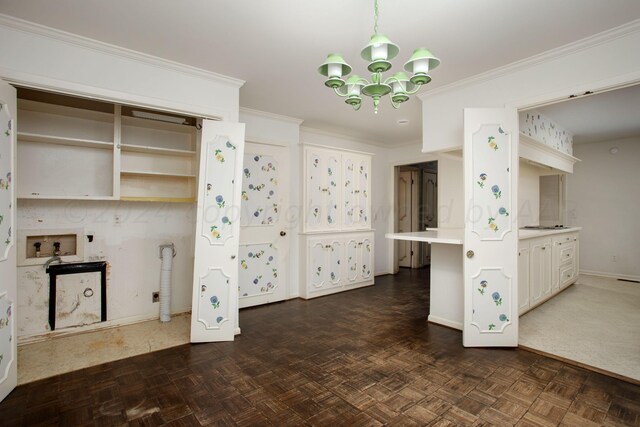 4321 Emil Ave, Amarillo, TX 79106 - kitchen featuring a chandelier, baseboards, light countertops, ornamental molding, and hanging light fixtures