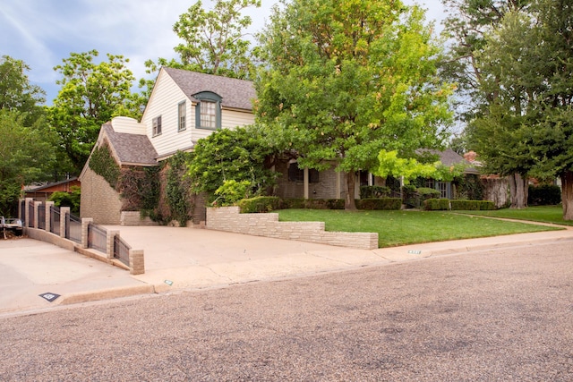 4321 Emil Ave, Amarillo, TX 79106 - view of property hidden behind natural elements with a shingled roof