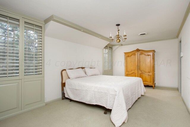 4321 Emil Ave, Amarillo, TX 79106 - bedroom featuring a chandelier, light colored carpet, crown molding, and baseboards