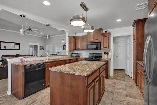 905 Red Deer Ln, White Deer, TX 79097 - kitchen featuring black appliances, a peninsula, ceiling fan, pendant lighting, and ornamental molding