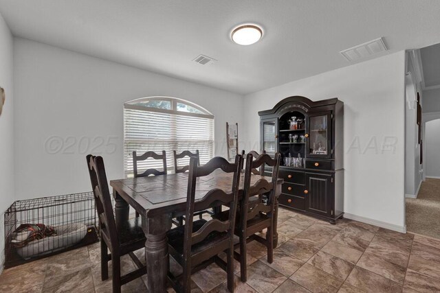 905 Red Deer Ln, White Deer, TX 79097 - dining space with baseboards and light stone finish floors