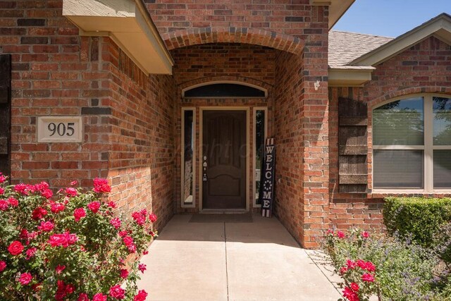 905 Red Deer Ln, White Deer, TX 79097 - property entrance with brick siding and roof with shingles