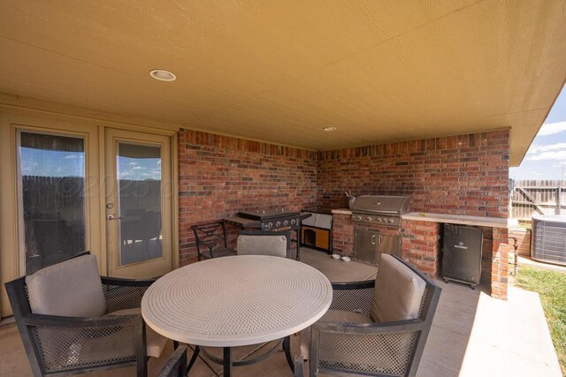 905 Red Deer Ln, White Deer, TX 79097 - view of patio with central air condition unit and outdoor dining space