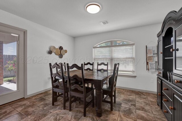905 Red Deer Ln, White Deer, TX 79097 - dining room with baseboards and dark stone finish floors