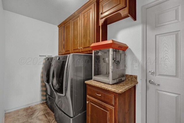 905 Red Deer Ln, White Deer, TX 79097 - laundry room featuring washer and dryer, cabinet space, and baseboards