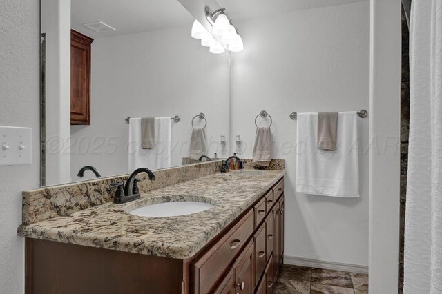 905 Red Deer Ln, White Deer, TX 79097 - bathroom with double vanity and baseboards