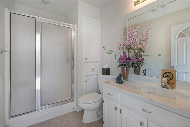 3511 Kensington Pl, Amarillo, TX 79121 - full bath featuring a shower stall, toilet, vanity, and tile patterned flooring