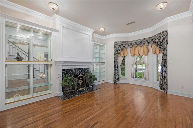 3511 Kensington Pl, Amarillo, TX 79121 - unfurnished living room featuring wood finished floors, baseboards, a high end fireplace, and crown molding