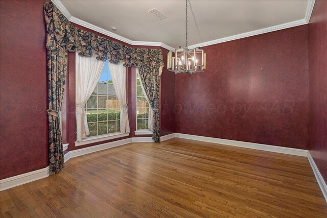 3511 Kensington Pl, Amarillo, TX 79121 - unfurnished room with a chandelier, wood finished floors, baseboards, and ornamental molding