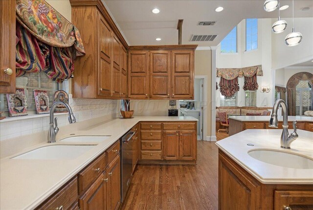 3511 Kensington Pl, Amarillo, TX 79121 - kitchen featuring a sink, brown cabinetry, stainless steel dishwasher, and recessed lighting