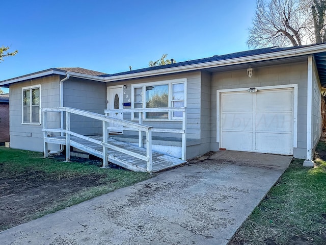 ranch-style home with a garage