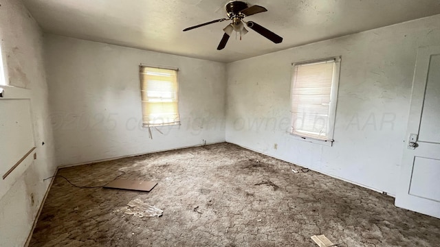 spare room with a ceiling fan