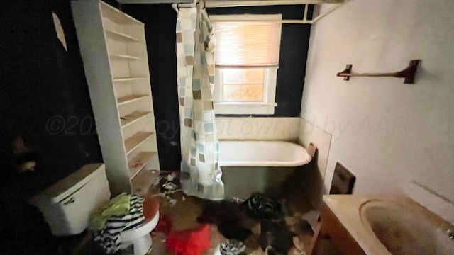 bathroom with toilet, a shower with curtain, and a bathtub