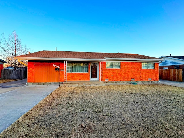 ranch-style home featuring brick siding, crawl space, and fence