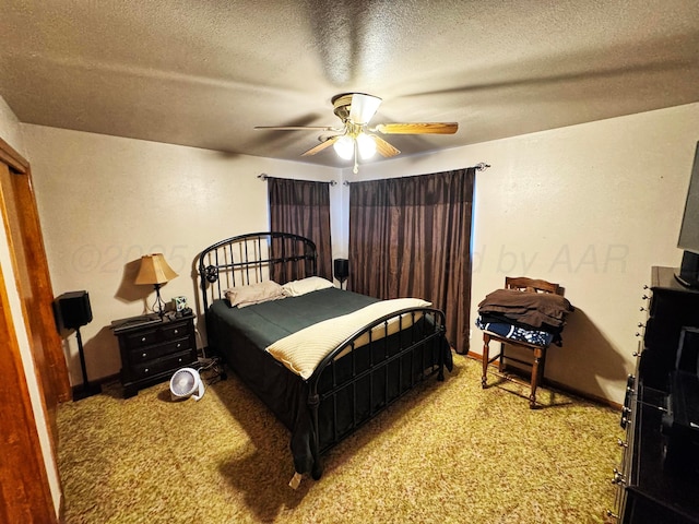 bedroom featuring a textured ceiling, ceiling fan, carpet, and baseboards