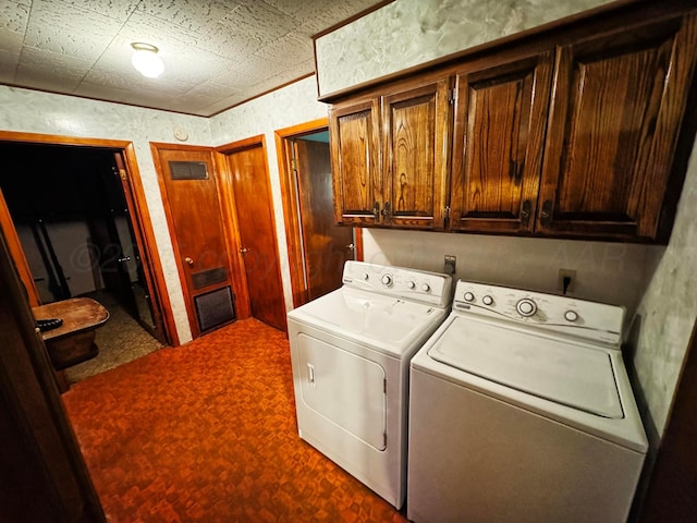 laundry room with cabinet space and washing machine and clothes dryer