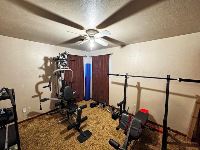 exercise room featuring carpet, ceiling fan, a textured ceiling, and baseboards