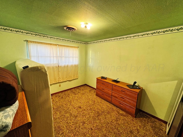 interior space with visible vents, dark carpet, a textured ceiling, and baseboards