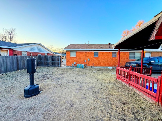 view of yard featuring cooling unit and fence