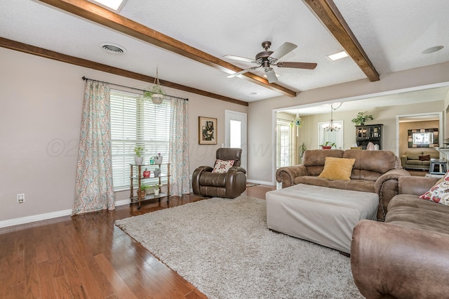 8615 Olympia Dr, Amarillo, TX 79110 - living room with baseboards, a chandelier, ceiling fan, beamed ceiling, and wood finished floors