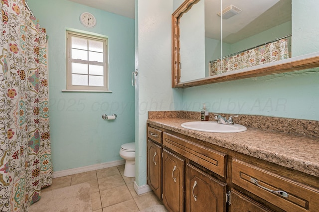 8615 Olympia Dr, Amarillo, TX 79110 - bathroom featuring vanity, toilet, baseboards, tile patterned floors, and a shower with curtain