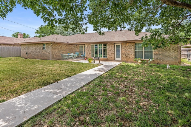 8615 Olympia Dr, Amarillo, TX 79110 - back of house featuring brick siding and a patio area