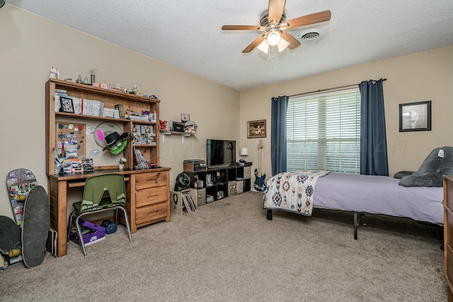 8615 Olympia Dr, Amarillo, TX 79110 - carpeted bedroom featuring a textured ceiling and ceiling fan