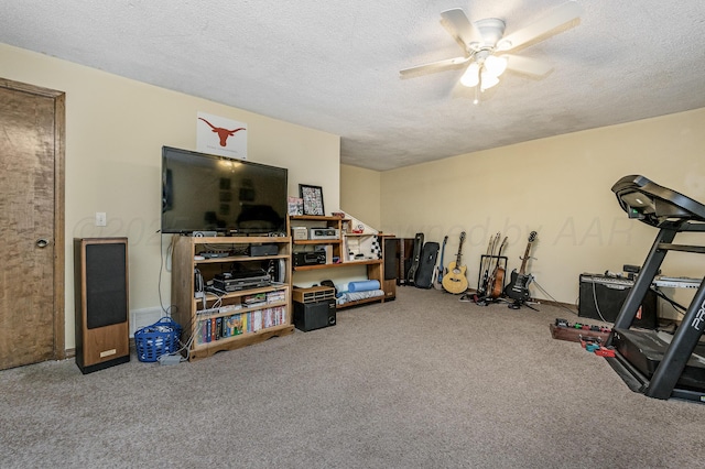 8615 Olympia Dr, Amarillo, TX 79110 - workout area with carpet, ceiling fan, and a textured ceiling