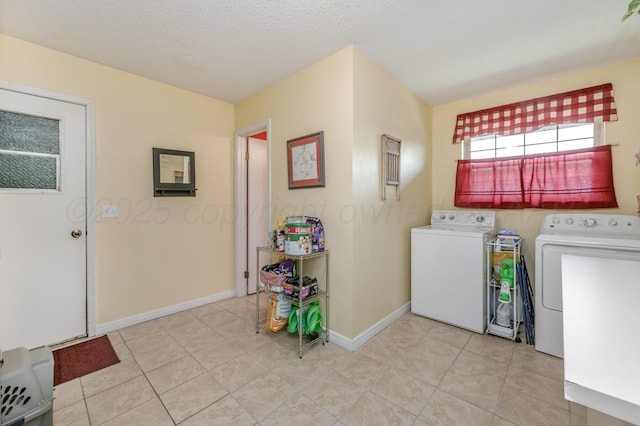 8615 Olympia Dr, Amarillo, TX 79110 - laundry room featuring washing machine and clothes dryer, light tile patterned floors, and baseboards