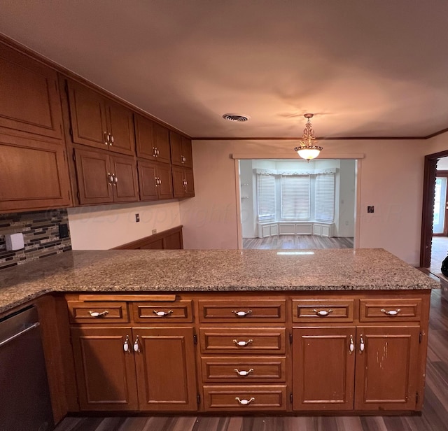 6201 Adirondack Trl, Amarillo, TX 79106 - kitchen featuring stainless steel dishwasher, a peninsula, dark wood-style floors, tasteful backsplash, and light stone counters