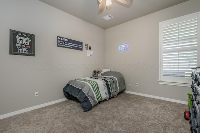 bedroom with ceiling fan and light colored carpet