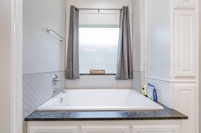 bathroom featuring a washtub