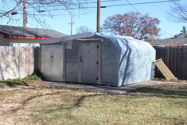 view of outbuilding featuring a yard