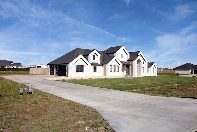 9800 Barton Springs Dr, Amarillo, TX 79119 - modern farmhouse style home featuring driveway, a residential view, a shingled roof, and a garage