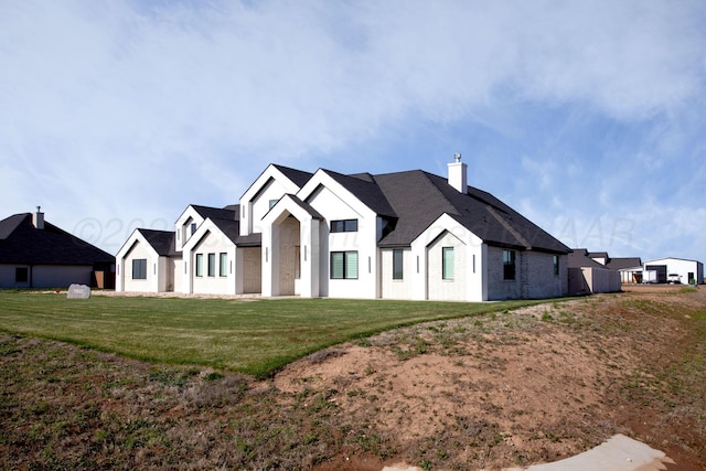 9800 Barton Springs Dr, Amarillo, TX 79119 - modern farmhouse featuring a chimney and a front lawn