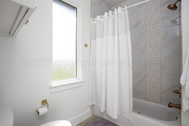 9800 Barton Springs Dr, Amarillo, TX 79119 - bathroom featuring toilet, shower / tub combo with curtain, and baseboards