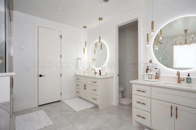 9800 Barton Springs Dr, Amarillo, TX 79119 - bathroom featuring marble finish flooring, two vanities, toilet, a chandelier, and a shower