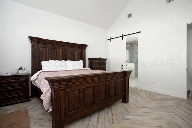 9800 Barton Springs Dr, Amarillo, TX 79119 - bedroom with a barn door, high vaulted ceiling, baseboards, and ensuite bathroom