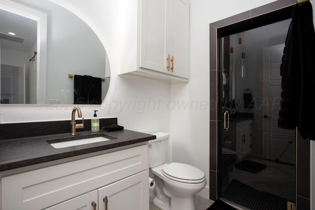 9800 Barton Springs Dr, Amarillo, TX 79119 - bathroom with toilet, vanity, and a stall shower