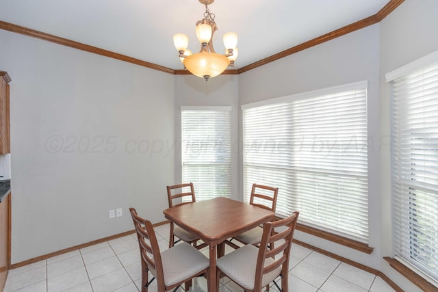 dining room featuring crown molding, a notable chandelier, light tile patterned floors, and baseboards
