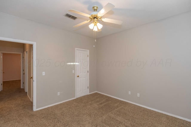 unfurnished bedroom featuring ceiling fan, carpet, visible vents, and baseboards