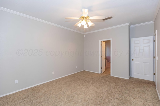 unfurnished bedroom with visible vents, baseboards, ensuite bath, crown molding, and light colored carpet