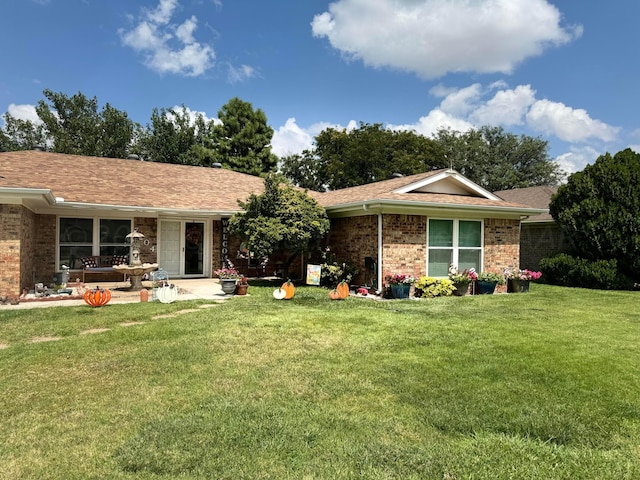 7204 SW 39th Ave, Amarillo, TX 79109 - ranch-style house with a front lawn, brick siding, and a shingled roof